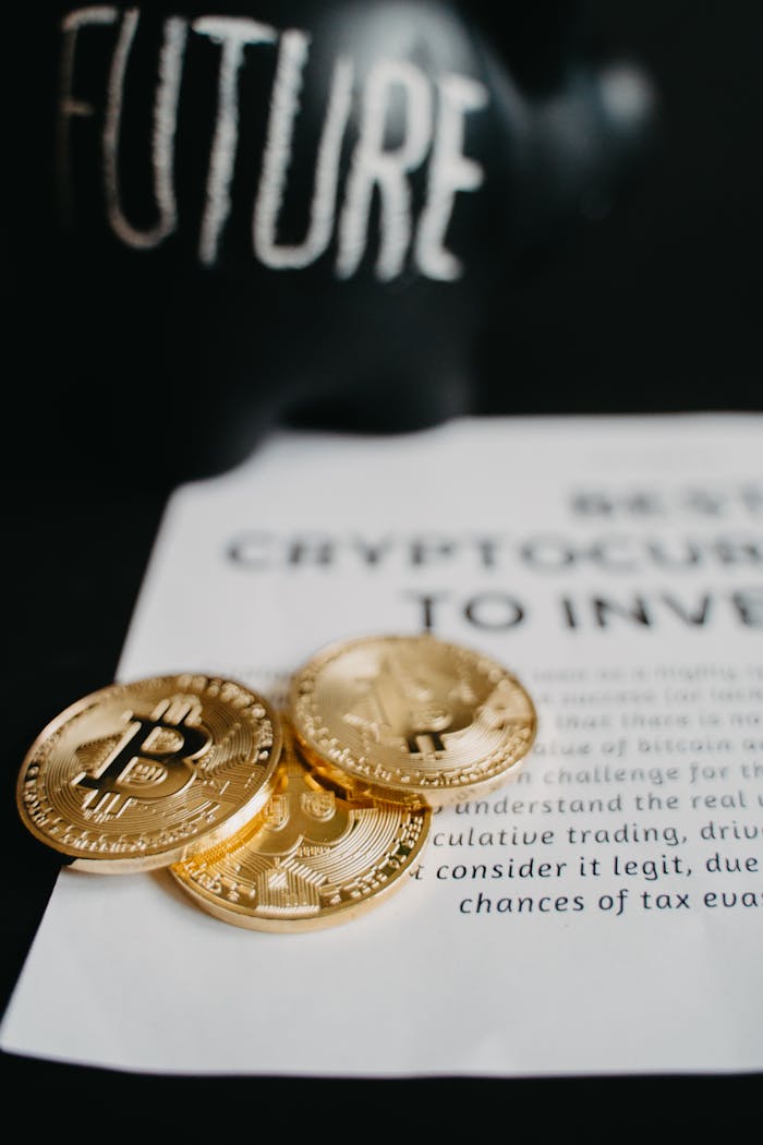 Focus on gold Bitcoin coins atop an investment article with future-themed decor.